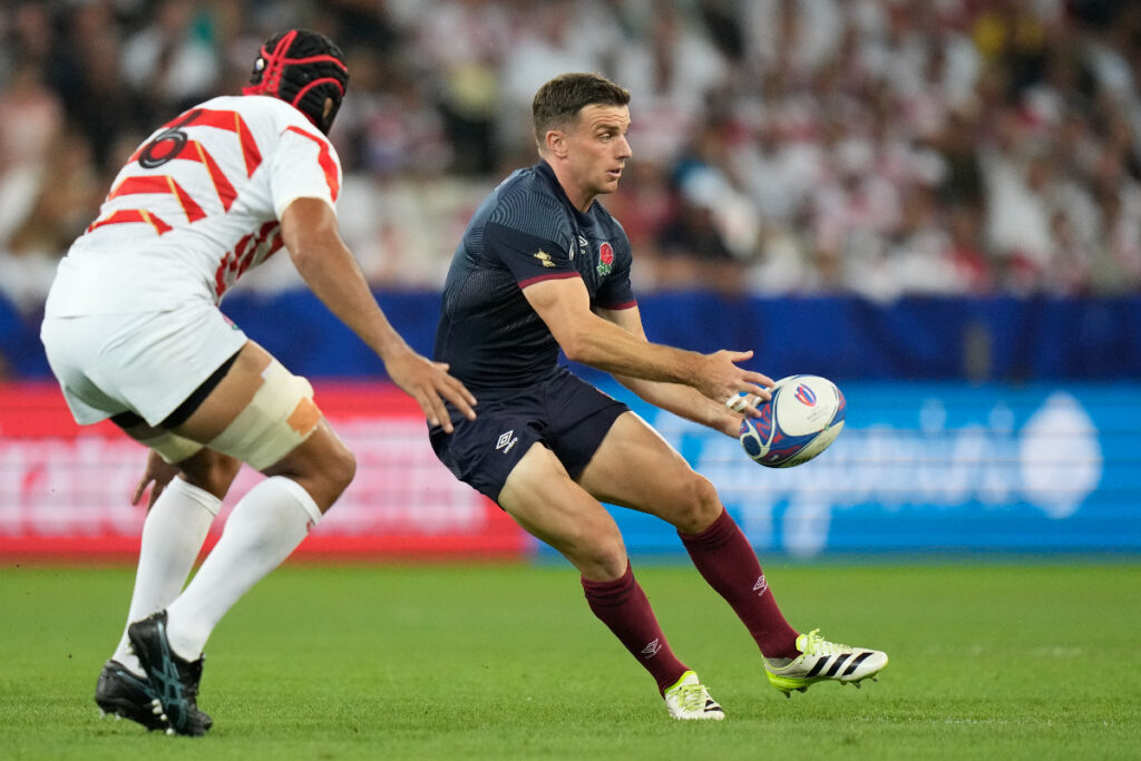 England's George Ford passes the ball under pressure from Japan's Michael Leitch during the Rugby World Cup Pool D match between England and Japan in the Stade de Nice, in Nice, France Sunday, Sept. 17, 2023. (AP Photo/Pavel Golovkin)