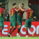 Portugal's Goncalo Inacio, 2nd right, celebrates with Bruno Fernandes, right, and Goncalo Ramos after scoring his side's fourth goal during the Euro 2024 group J qualifying soccer match between Portugal and Luxembourg at the Algarve stadium outside Faro, Portugal, Monday, Sept. 11, 2023. (AP Photo/Joao Matos)