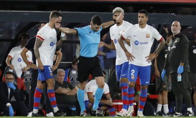Referee gestures during a Spanish La Liga soccer match between Mallorca and Barcelona at the Son Moix stadium in Palma de Mallorca, Spain, Tuesday, Sept. 26, 2023. (AP Photo/Francisco Ubilla)