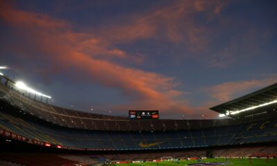 FILE - A general view of the the Camp Nou stadium as the sun sets ahead of the Spanish La Liga soccer match between FC Barcelona and Valladolid CF in Barcelona, Spain, on April 5, 2021. Spanish police raided offices of the Spanish soccer federation on Thursday Sept. 28, 2023 as part of a judicial investigation into the alleged payment of millions of euros over several years by Barcelona soccer club to the vice president of Spain’s football refereeing committee. (AP Photo/Joan Monfort, File)