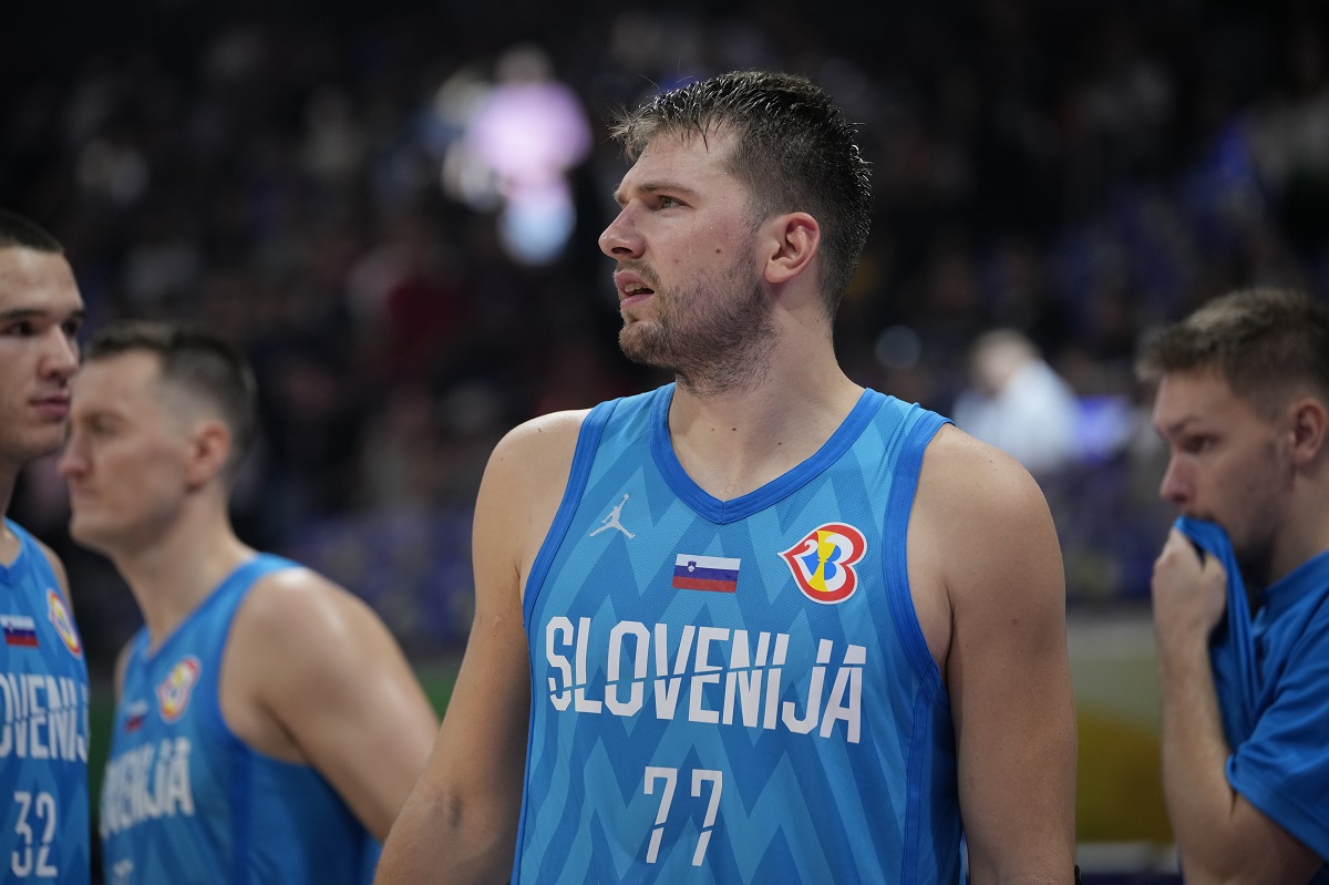 Slovenia guard Luka Doncic (77) celebrates after winning against Italy during the Basketball World Cup classification match in Manila, Philippines, Saturday, Sept. 9, 2023.