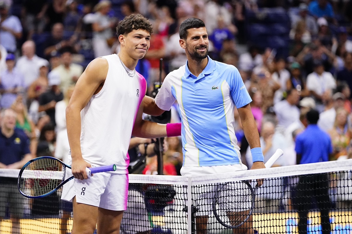 Ben Shelton, left, of the United States, and Novak Djokovic, of Serbia, pose for photographs ahead of their match during the men's singles semifinals of the U.S. Open tennis championships, Friday, Sept. 8, 2023, in New York.
