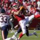 Kansas City Chiefs tight end Travis Kelce catches a pass as Chicago Bears cornerback Jaylon Johnson (33) defends during the first half of an NFL football game Sunday, Sept. 24, 2023, in Kansas City, Mo. (AP Photo/Ed Zurga)