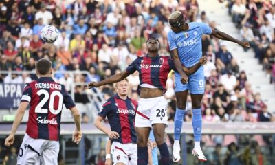 Napoli's Victor Osimhen, top right, heads the ball during the Serie A soccer match between Bologna and Napoli at the Renato Dall'Ara stadium in Bologna, Italy, Sunday, Sept. 24, 2023. (Massimo Paolone/LaPresse via AP)