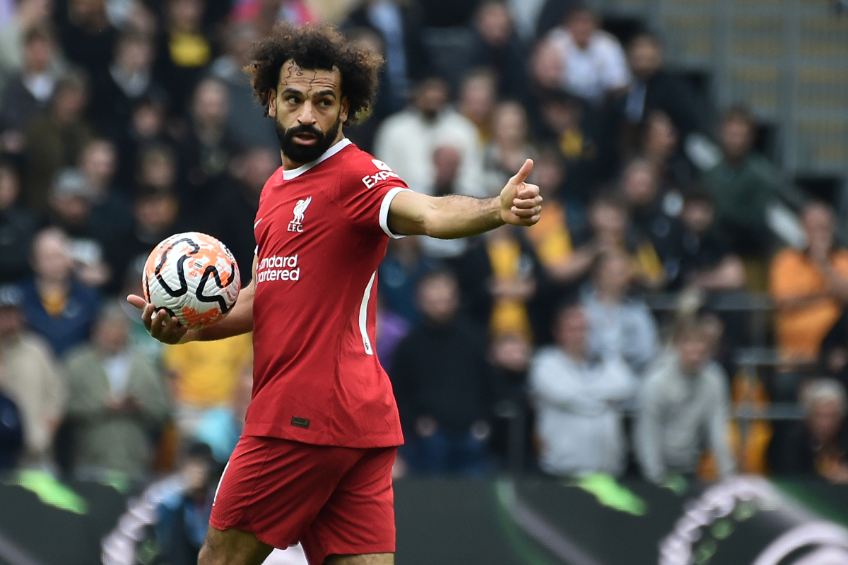 Liverpool's Mohamed Salah celebrates after Liverpool's Cody Gakpo scored his side's opening goal during the English Premier League soccer match between Wolverhampton and Liverpool at the Molineux stadium in Wolverhampton, England, Saturday, Sept. 16, 2023. (AP Photo/Rui Vieira)