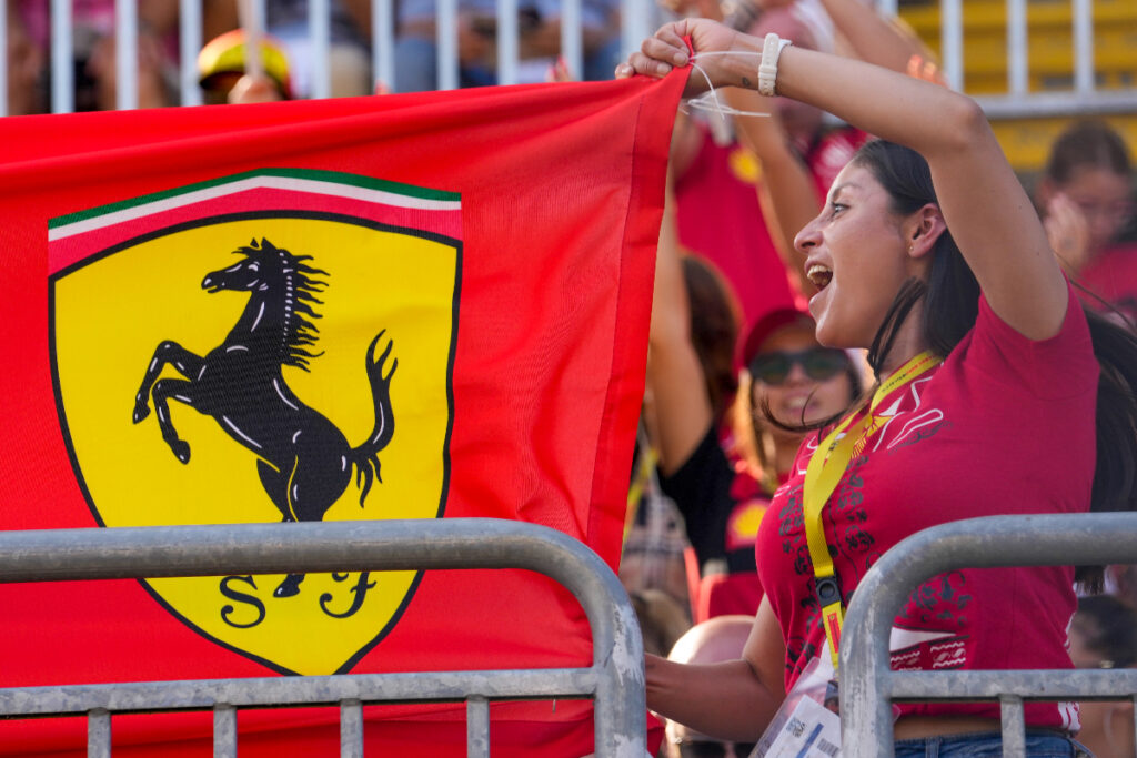 Ferrari supporters cheer on stands during the qualifying session ahead of Sunday's Formula One Italian Grand Prix auto race, at the Monza racetrack, in Monza, Italy, Saturday, Sept. 2, 2023. (AP Photo/Luca Bruno)