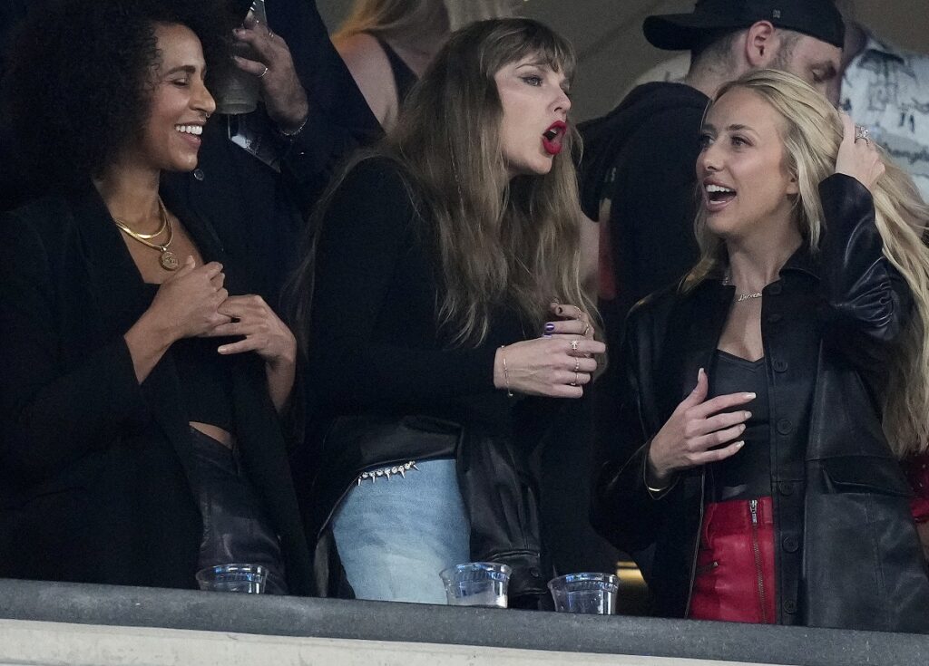 CORRECTS TO BRITTANY MAHOMES NOT BLAKE LIVELY - Taylor Swift, center, and Brittany Mahomes, right, watch play between the New York Jets and the Kansas City Chiefs during the second quarter of an NFL football game, Sunday, Oct. 1, 2023, in East Rutherford, N.J. (AP Photo/Frank Franklin II)