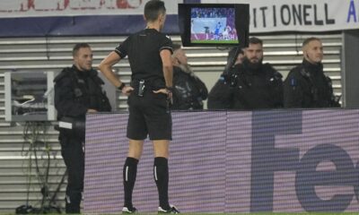 Referee Jose Maria Sanchez looks at the VAR screen during the group G Champions League soccer match between RB Leipzig and Red Star Belgrade at the Red Bull arena stadium in Leipzig, Germany, Wednesday, Oct. 25, 2023. (AP Photo/Matthias Schrader)