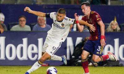 LA Galaxy forward Dejan Joveljic, left, and Real Salt Lake defender Bryan Oviedo vie for the ball during the second half of an MLS soccer match Saturday, Oct. 14, 2023, in Carson, Calif. (AP Photo/Ryan Sun)