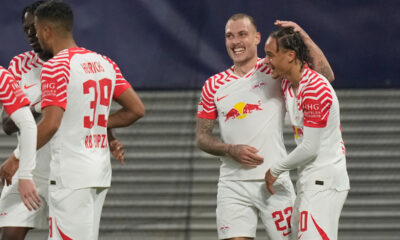Leipzig's David Raum, centre right, celebrates after scoring his side's opening goal during the group G Champions League soccer match between RB Leipzig and Red Star Belgrade at the Red Bull arena stadium in Leipzig, Germany, Wednesday, Oct. 25, 2023. (AP Photo/Matthias Schrader)