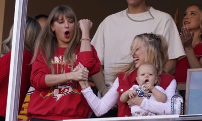 Taylor Swift celebrates with Brittany Mahomes as they watch from a suit during the first half of an NFL football game between the Kansas City Chiefs and the Los Angeles Chargers Sunday, Oct. 22, 2023, in Kansas City, Mo. (AP Photo/Ed Zurga)