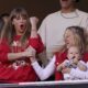 Taylor Swift celebrates with Brittany Mahomes as they watch from a suit during the first half of an NFL football game between the Kansas City Chiefs and the Los Angeles Chargers Sunday, Oct. 22, 2023, in Kansas City, Mo. (AP Photo/Ed Zurga)