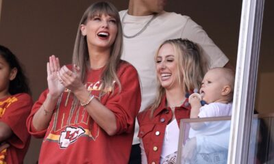 Taylor Swift cheers alongside Brittany Mahomes, right, before the start of an NFL football game between the Kansas City Chiefs and the Los Angeles Chargers Sunday, Oct. 22, 2023, in Kansas City, Mo. (AP Photo/Charlie Riedel)