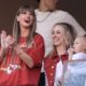 Taylor Swift cheers alongside Brittany Mahomes, right, before the start of an NFL football game between the Kansas City Chiefs and the Los Angeles Chargers Sunday, Oct. 22, 2023, in Kansas City, Mo. (AP Photo/Charlie Riedel)