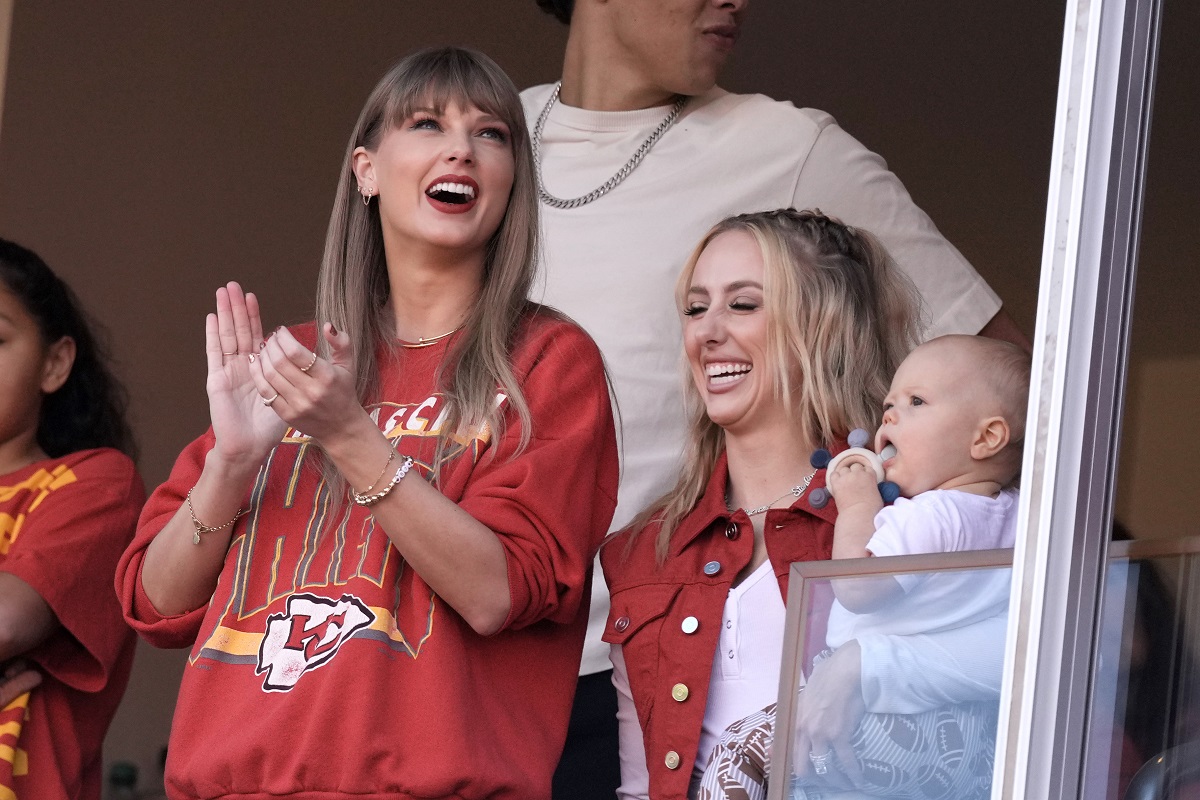 Taylor Swift cheers alongside Brittany Mahomes, right, before the start of an NFL football game between the Kansas City Chiefs and the Los Angeles Chargers Sunday, Oct. 22, 2023, in Kansas City, Mo. (AP Photo/Charlie Riedel)