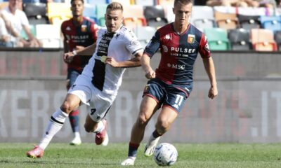 Genoa's Albert Gudmundsson, right, controls the ball from Udinese's Sandi Lovric during a Serie A soccer match between Udinese and Genoa, in Udine's Friuli stadium, northern Italy, Sunday, Oct. 1, 2023.(Andrea Bressanutti/LaPresse via AP)