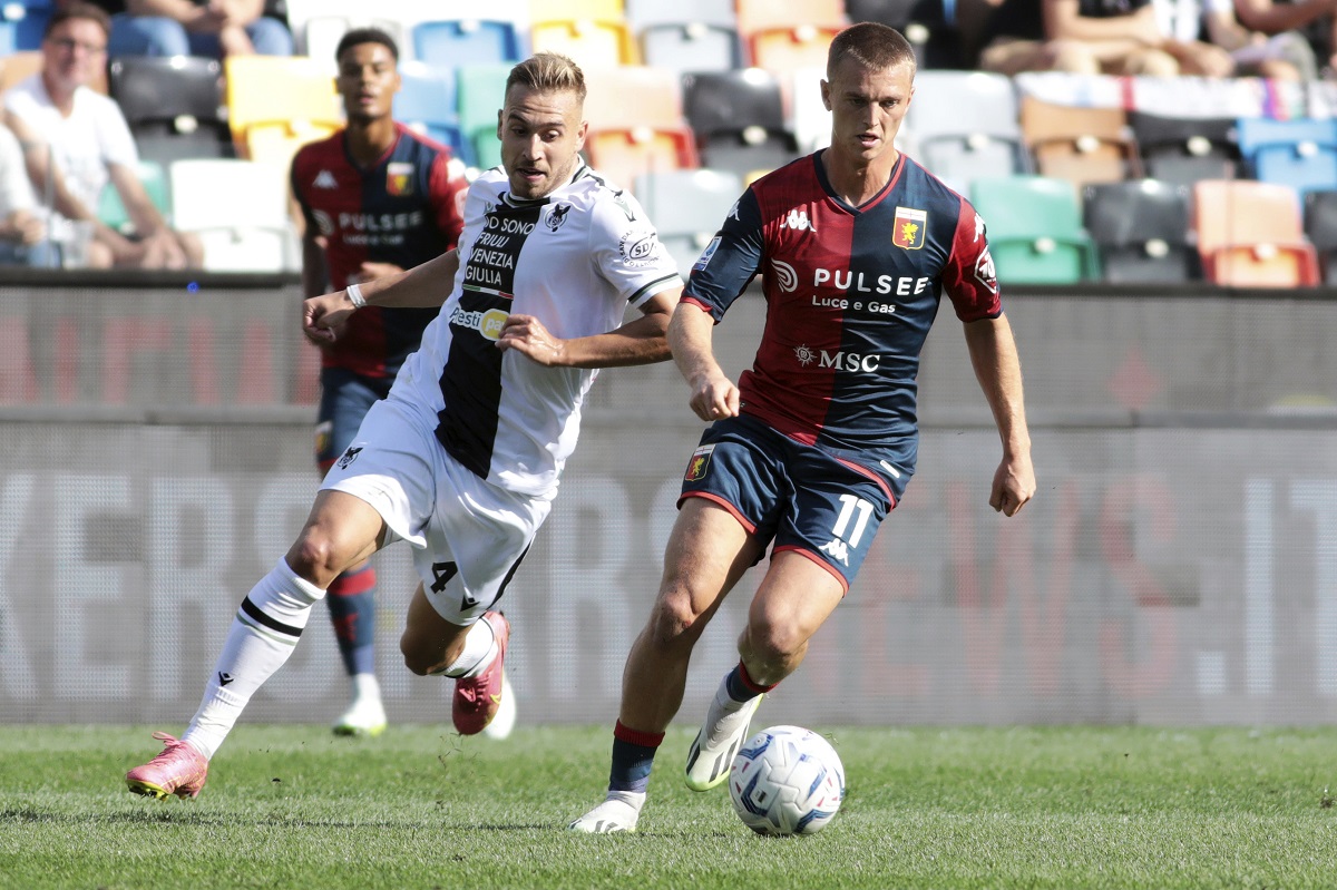 Genoa's Albert Gudmundsson, right, controls the ball from Udinese's Sandi Lovric during a Serie A soccer match between Udinese and Genoa, in Udine's Friuli stadium, northern Italy, Sunday, Oct. 1, 2023.(Andrea Bressanutti/LaPresse via AP)