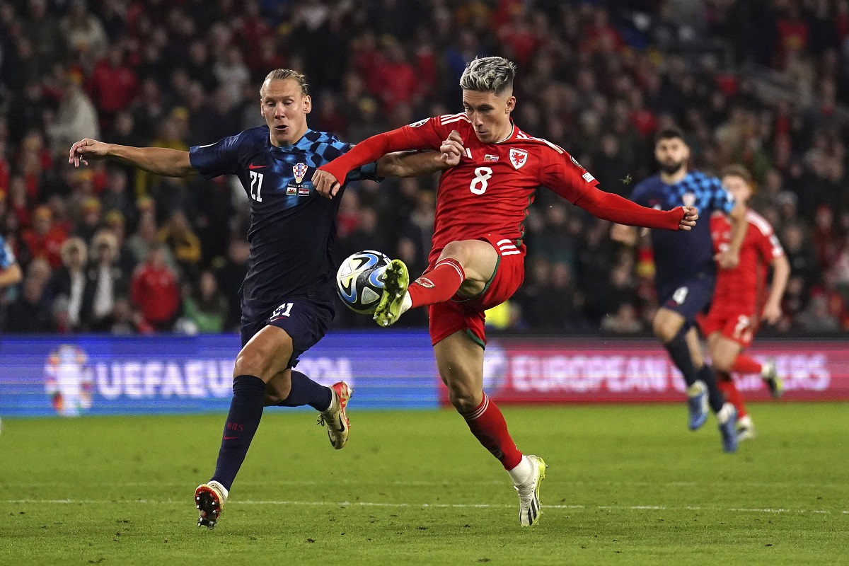 Wales' Harry Wilson, right, scores the team's first goal of the game, during the Euro 2024 Qualifying Group D match at the Cardiff City Stadium in Wales, Sunday, Oct. 15, 2023. (Tim Goode/PA via AP)