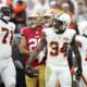 Cleveland Browns offensive tackle Jedrick Wills Jr. (71) and running back Jerome Ford (34) react during the second half of an NFL football game against the San Francisco 49ers Sunday, Oct. 15, 2023, in Cleveland. (AP Photo/Sue Ogrocki)