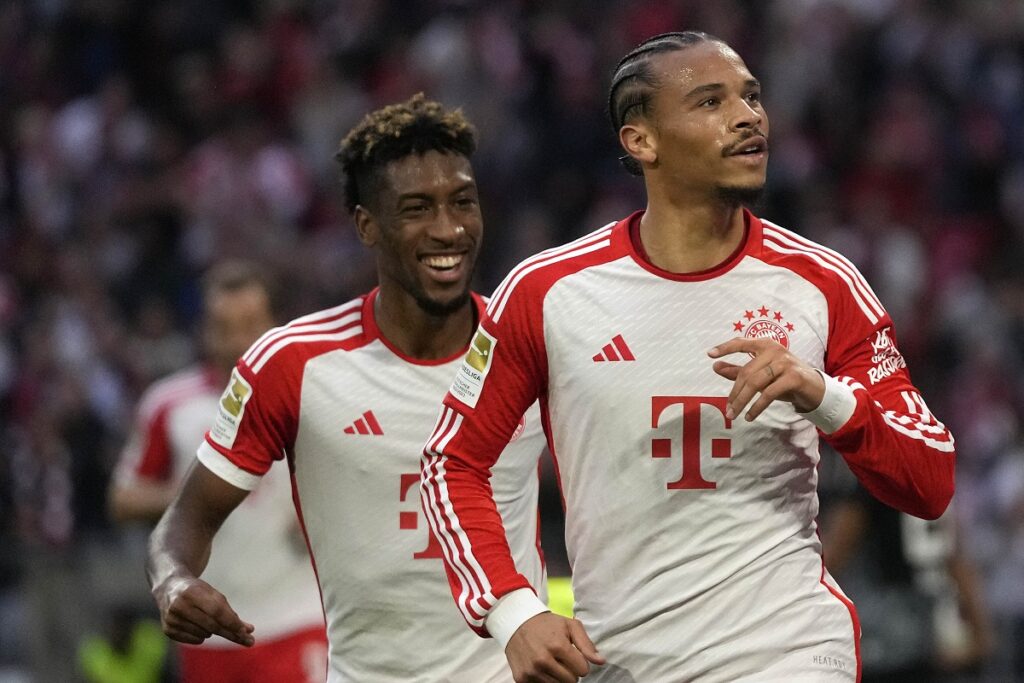 Bayern's Leroy Sane, right, and Kingsley Coman celebrate during the German Bundesliga soccer match between FC Bayern Munich and SC Freiburg at the Allianz Arena stadium in Munich, Germany, Oct. 8, 2023. (AP Photo/Matthias Schrader)