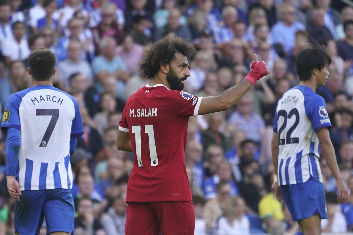 Liverpool's Mohamed Salah, centre, reacts after the Premier League soccer match between Brighton and Hove Albion and Liverpool at the American Express Community Stadium in Brighton, England, Sunday, Oct. 8, 2023. (AP Photo/Alberto Pezzali)