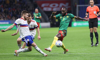 Cameroon's Moumi Ngamaleu, right, fights for the ball with Russia's Danil Glebov during an international friendly soccer match between Russia and Cameroon at VTB Arena in Moscow, Russia, Thursday, Oct. 12, 2023. (AP Photo/Alexander Safonov)