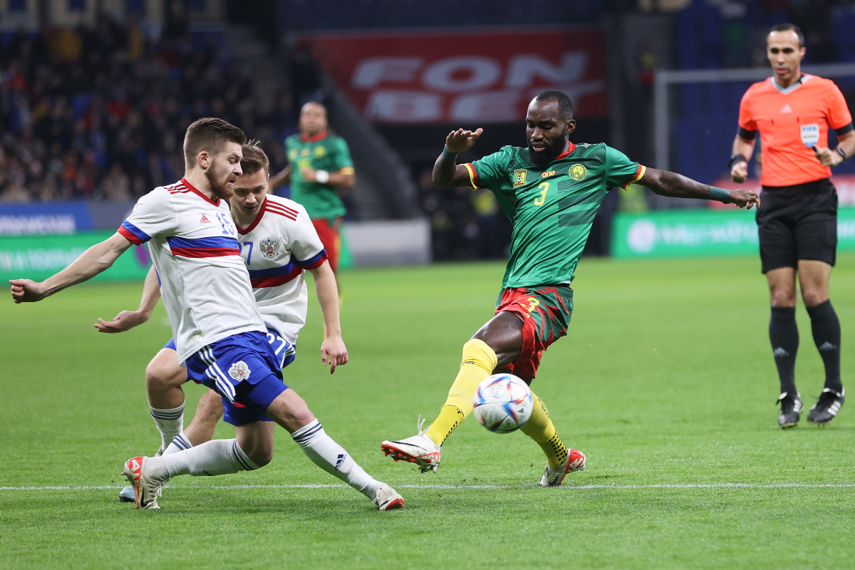 Cameroon's Moumi Ngamaleu, right, fights for the ball with Russia's Danil Glebov during an international friendly soccer match between Russia and Cameroon at VTB Arena in Moscow, Russia, Thursday, Oct. 12, 2023. (AP Photo/Alexander Safonov)