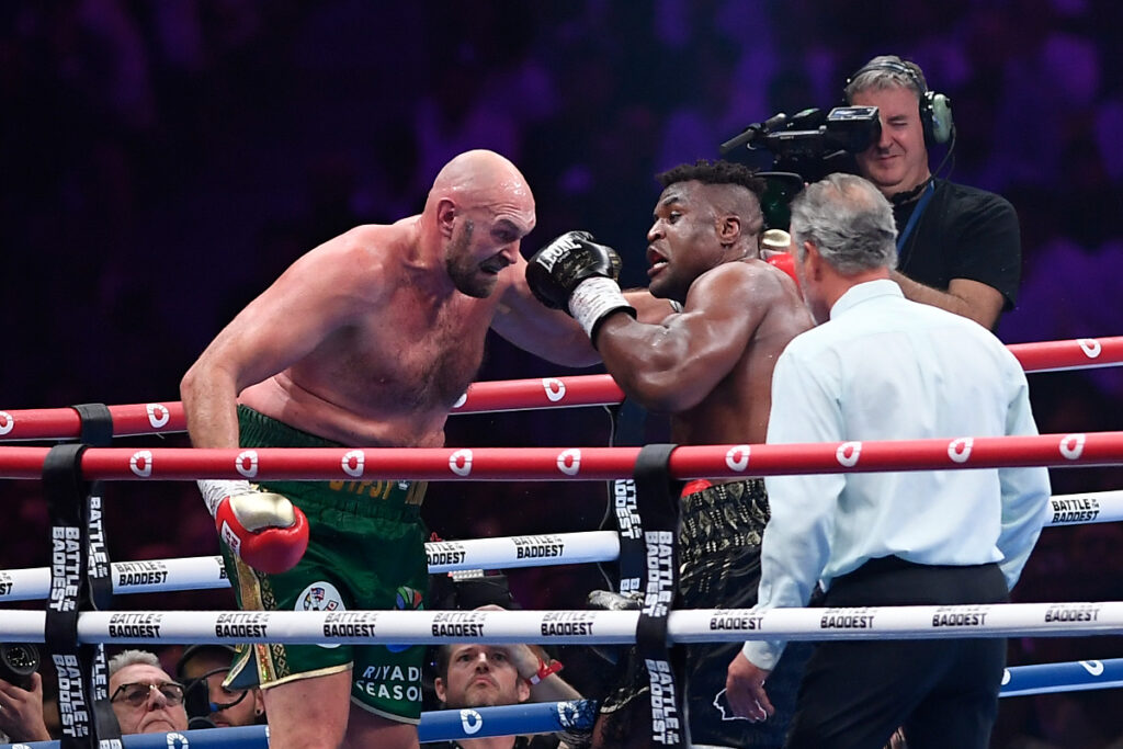 Tyson Fury, of England, the WBC and lineal heavyweight champion, fights with former UFC heavyweight champion Francis Ngannou, of Cameroon, during their boxing match to mark the start of Riyadh Season at Kingdom Arena, in Riyadh, Saudi Arabia, Sunday, Oct. 29, 2023. (AP Photo/Yazeed Aldhawaihi)