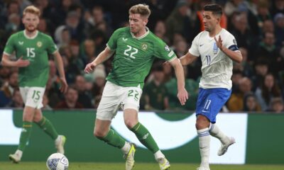 Republic of Ireland's Nathan Collins and Greece's Anastasios Bakasetas, right, battle for the ball during the Euro 2024 qualifying Group B soccer match between Ireland and Greece at the Aviva Stadium, Dublin, Friday Oct. 13, 2023. (Liam McBurney/PA via AP)