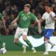 Republic of Ireland's Nathan Collins and Greece's Anastasios Bakasetas, right, battle for the ball during the Euro 2024 qualifying Group B soccer match between Ireland and Greece at the Aviva Stadium, Dublin, Friday Oct. 13, 2023. (Liam McBurney/PA via AP)