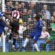 Brentford's Ethan Pinnock, second left, scores his side's opening goal during the English Premier League soccer match between Chelsea and Brentford at Stamford Bridge stadium in London, Saturday, Oct. 28, 2023. (AP Photo/Ian Walton)