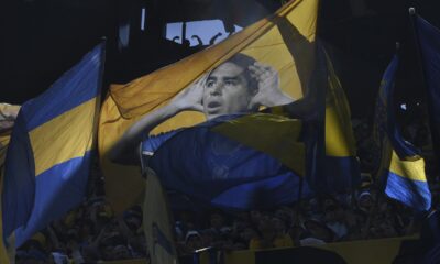 Fans of Boca Juniors cheer for their team during a local tournament soccer match against River Plate at La Bombonera stadium in Buenos Aires, Argentina, Sunday, Oct. 1, 2023. (AP Photo/Gustavo Garello)