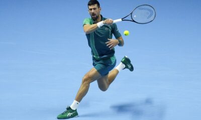 Serbia's Novak Djokovic plays a forehand return to Spain's Carlos Alcaraz during their singles semifinal tennis match of the ATP World Tour Finals at the Pala Alpitour, in Turin, Italy, Saturday, Nov. 18, 2023. (AP Photo/Antonio Calanni)