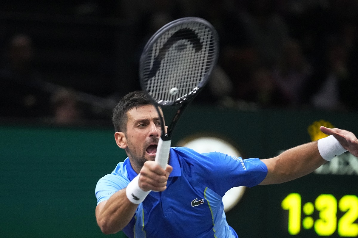 Serbia's Novak Djokovic returns the ball to Denmark's Holger Rune during their quarterfinal match of the Paris Masters tennis tournament, at the Accor Arena in Paris, Friday, Nov. 3, 2023. (AP Photo/Michel Euler)