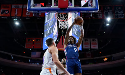Philadelphia 76ers' Kelly Oubre Jr., right, goes up for a shot against Phoenix Suns' Kevin Durant, center, and Grayson Allen during the first half of an NBA basketball game, Saturday, Nov. 4, 2023, in Philadelphia. (AP Photo/Matt Slocum)