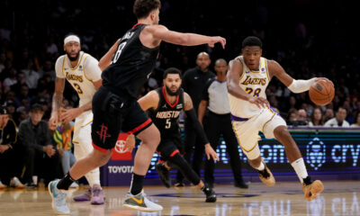 Los Angeles Lakers forward Rui Hachimura (28) drives against Houston Rockets center Alperen Sengun (28) during the second half of an NBA basketball game in Los Angeles, Sunday, Nov. 19, 2023. (AP Photo/Eric Thayer)