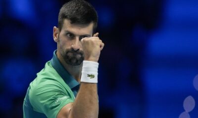 Serbia's Novak Djokovic reacts after winning a point to Italy's Jannik Sinner during their singles final tennis match of the ATP World Tour Finals at the Pala Alpitour, in Turin, Italy, Sunday, Nov. 19, 2023. (AP Photo/Antonio Calanni)