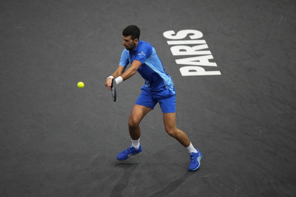 Serbia's Novak Djokovic returns the ball to Bulgaria's Grigor Dimitrov during the final match of the Paris Masters tennis tournament at the Accor Arena, in Paris, Sunday, Nov. 5, 2023. (AP Photo/Michel Euler)