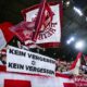 Freiburg's fans hold a poster with the inscription "No forgiveness - no forgetting" during the Europa League Group A soccer match between SC Freiburg and TSC Backa Topola in Freiburg, Germany, Thursday, Nov. 9, 2023. (Tom Weller/dpa via AP)