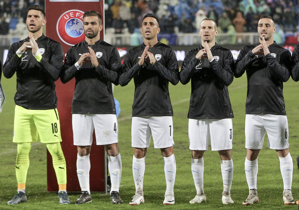Israel's players gesture and sing the Israeli national anthem prior to the Euro 2024 group I qualifying soccer match between Kosovo and Israel at the Fadil Vokrri stadium in Pristina, Kosovo, Sunday, Nov. 12, 2023. (AP Photo/Visar Kryeziu)