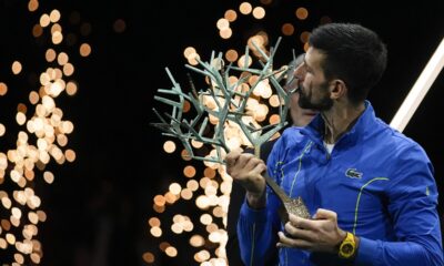Serbia's Novak Djokovic kisses the trophy after winning the final match against Bulgaria's Grigor Dimitrov at the Paris Masters tennis tournament Sunday, Nov. 5, 2023. (AP Photo/Michel Euler)
