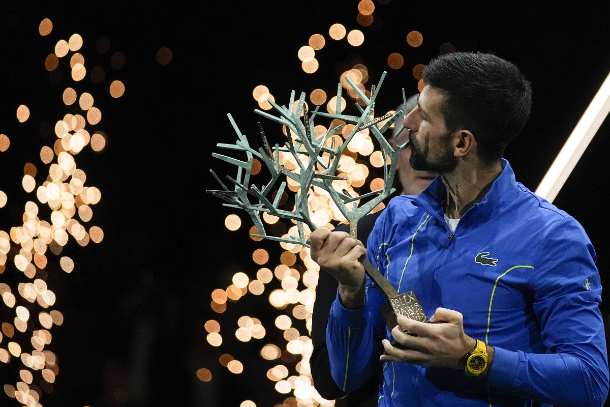Serbia's Novak Djokovic kisses the trophy after winning the final match against Bulgaria's Grigor Dimitrov at the Paris Masters tennis tournament Sunday, Nov. 5, 2023. (AP Photo/Michel Euler)