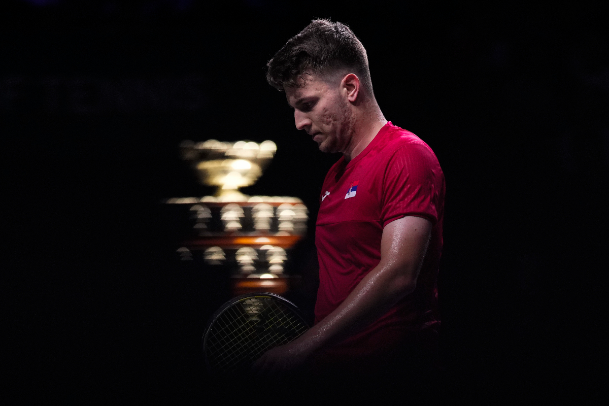 Serbia's Miomir Kecmanovic walks on the court, with the Davis Cup on the background, during a Davis Cup quarter-final tennis match between Serbia and United Kingdom in Malaga, Spain, Thursday, Nov. 23, 2023. (AP Photo/Manu Fernandez)