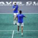 Italy's Janik Sinner, top, and Italy's Lorenzo Sonego celebrate after winning a point against Netherlands' Wesley Koolhof and Netherlands' Tallon Griekspoor during a Davis Cup quarter-final tennis match between Italy and Netherlands in Malaga, Spain, Thursday, Nov. 23, 2023. (AP Photo/Manu Fernandez)