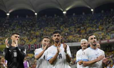 FILE - Israel's players applaud their fans at the end of the Euro 2024 qualifying soccer match between Romania and Israel at the National Arena stadium in Bucharest, Romania, Saturday, Sept. 9, 2023. Even before last month’s Hamas attacks in Israel, the leader of Hungary had long promoted his country as the safest in Europe for Jews. Now the Israeli men’s soccer team is taking his word and heading to a tiny Hungarian village as it prepares to play its remaining home games in the Euro 2024 qualifying tournament. Israel will host “home” games against Switzerland next Wednesday, Nov. 15, 2023. and Romania three days later. (AP Photo/Andreea Alexandru, File)