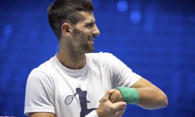 Serbia's Novak Djokovic stretches his wrist during a training session ahead of the ATP Finals, in Turin, Italy, Friday, Nov. 10, 2023. (Marco Alpozzi/LaPresse via AP)