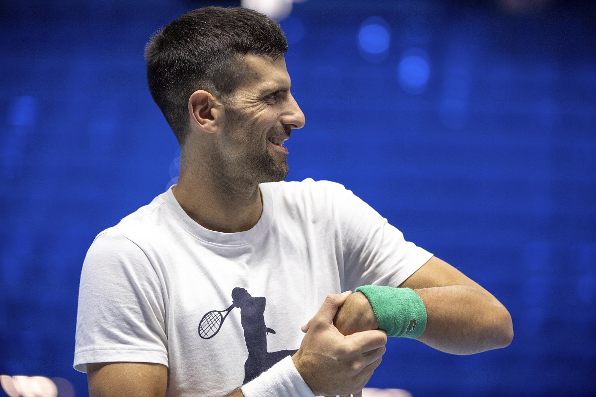 Serbia's Novak Djokovic stretches his wrist during a training session ahead of the ATP Finals, in Turin, Italy, Friday, Nov. 10, 2023. (Marco Alpozzi/LaPresse via AP)