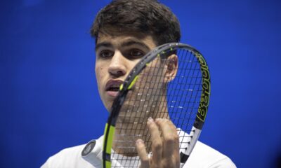 Spain's Carlos Alcaraz reacts as he plays Serbia's Novak Djokovic during a training session ahead of the ATP Finals, in Turin, Italy, Friday, Nov. 10, 2023. (Marco Alpozzi/LaPresse via AP)