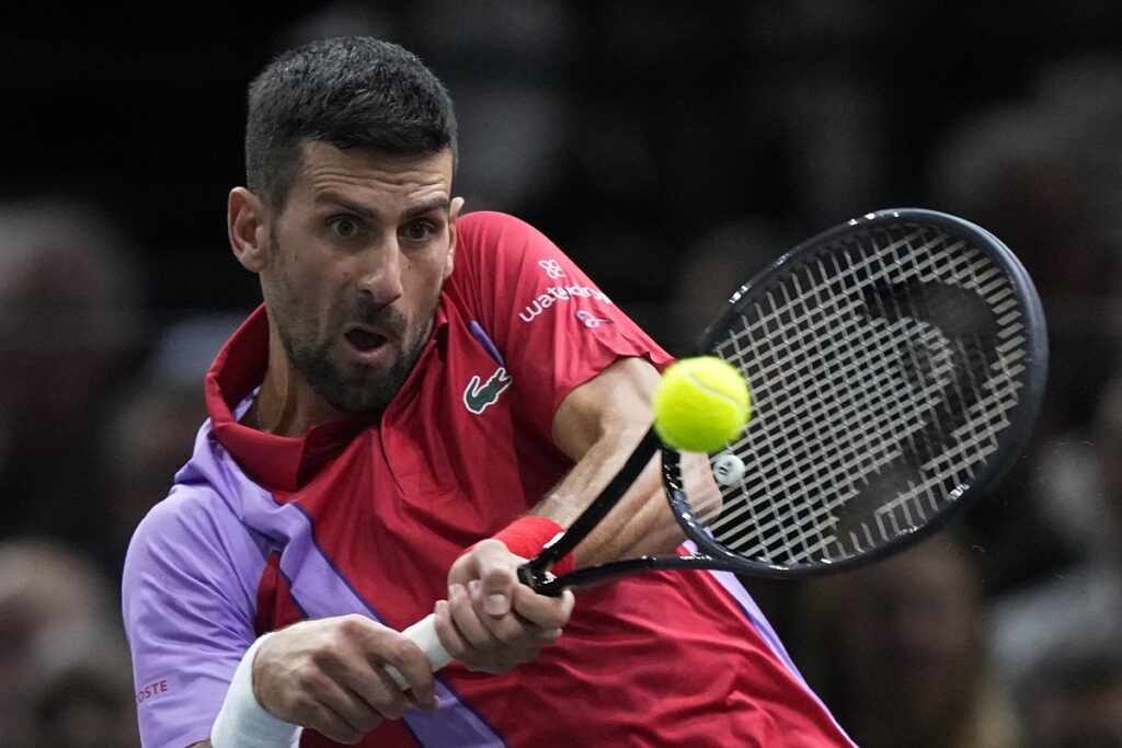 Serbia's Novak Djokovic returns the ball to Argentina's Tomas Martin Etcheverry during the second round of the Paris Masters tennis tournament, at the Accor Arena, Wednesday Nov.1, 2023 in Paris. (AP Photo/Michel Euler)
