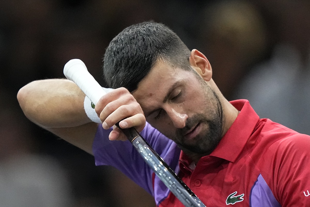 Serbia's Novak Djokovic wipes his forehead as he plays Argentina's Tomas Martin Etcheverry during the second round of the Paris Masters tennis tournament, at the Accor Arena, Wednesday Nov.1, 2023 in Paris. (AP Photo/Michel Euler)